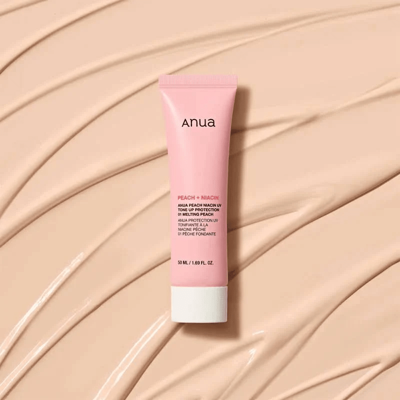 Anua Peach Niacin UV Tone Up Protection 01 Melting Peach 50ml on a cream texture background