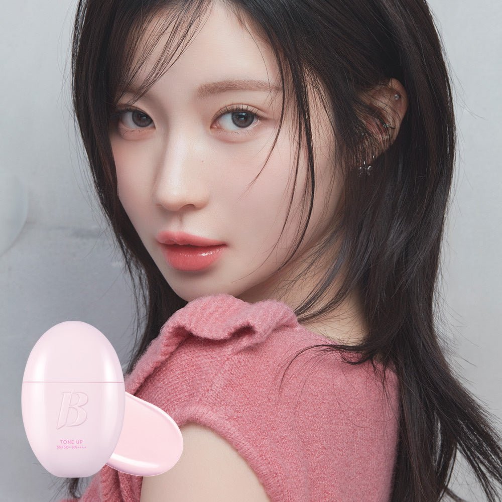 Banila Co All Day Prep Tone Up Base Cream SPF50+ PA++++ 35mL β Model holding the pink Tone Up Base Cream bottle