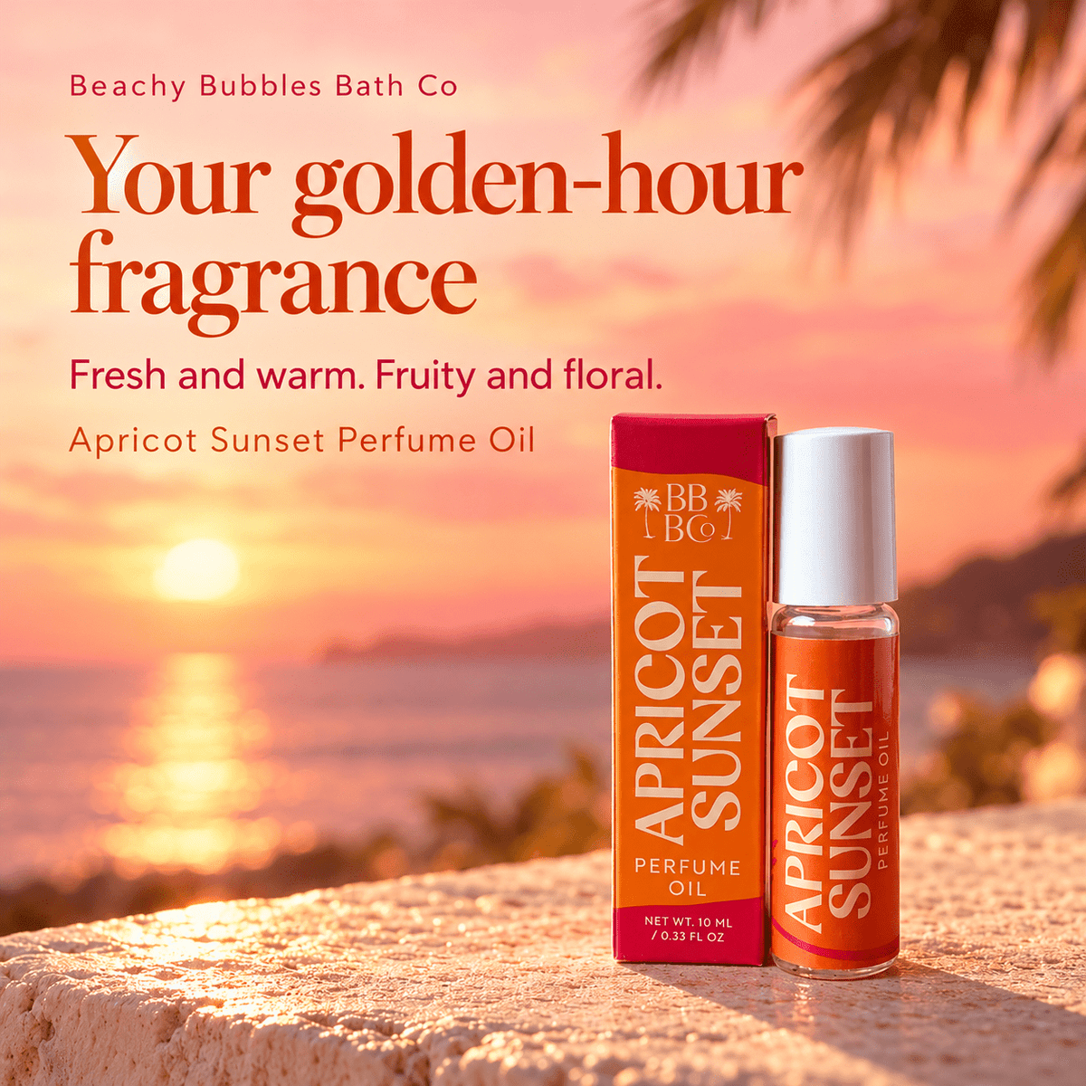Beachy Bubbles Bath Co Apricot Sunset Perfume Oil and carton in a coral sunset setting, highlighting its fresh and warm fruity-floral fragrance.