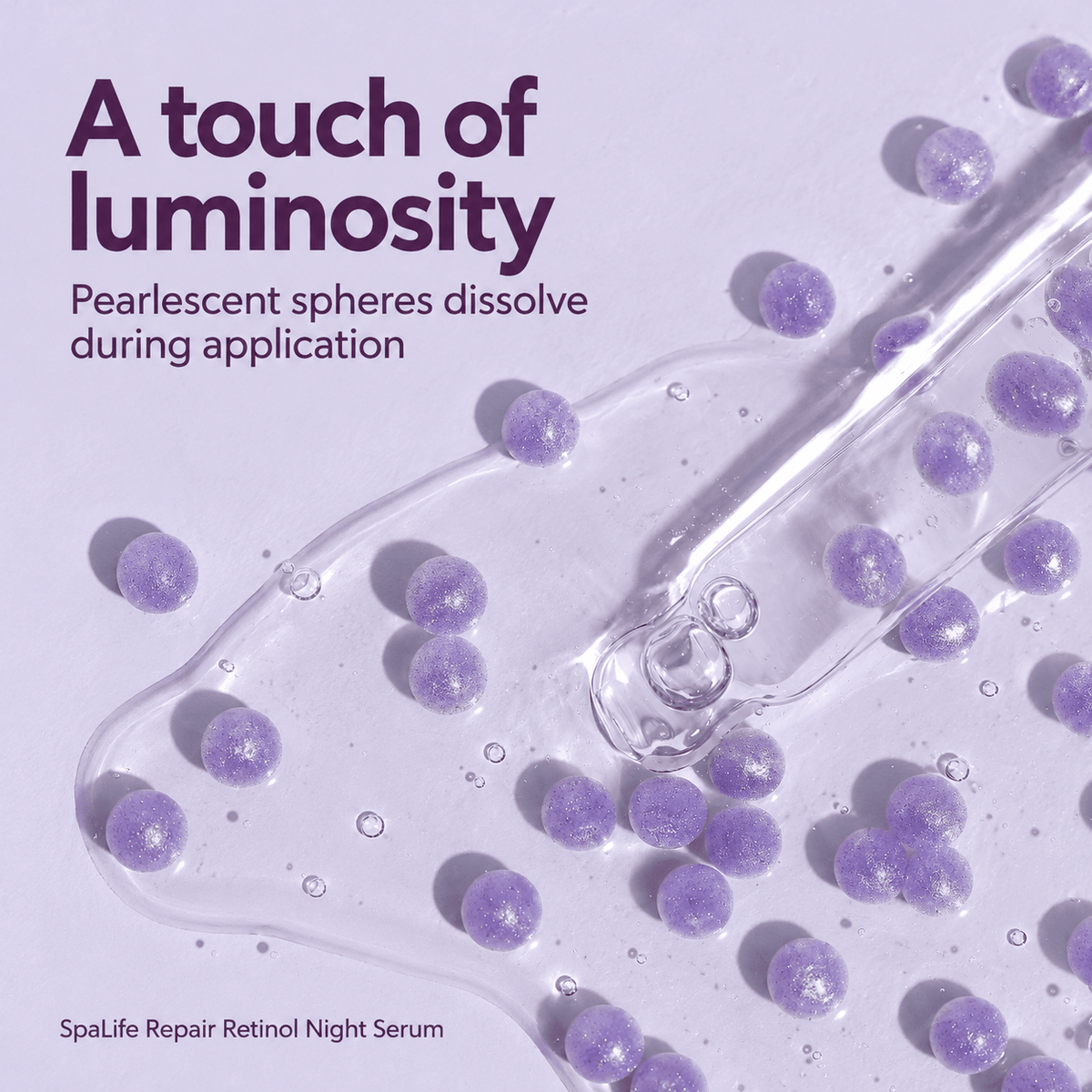 Close-up of SpaLife Repair serum with dissolving lavender pearlescent spheres and glass pipette