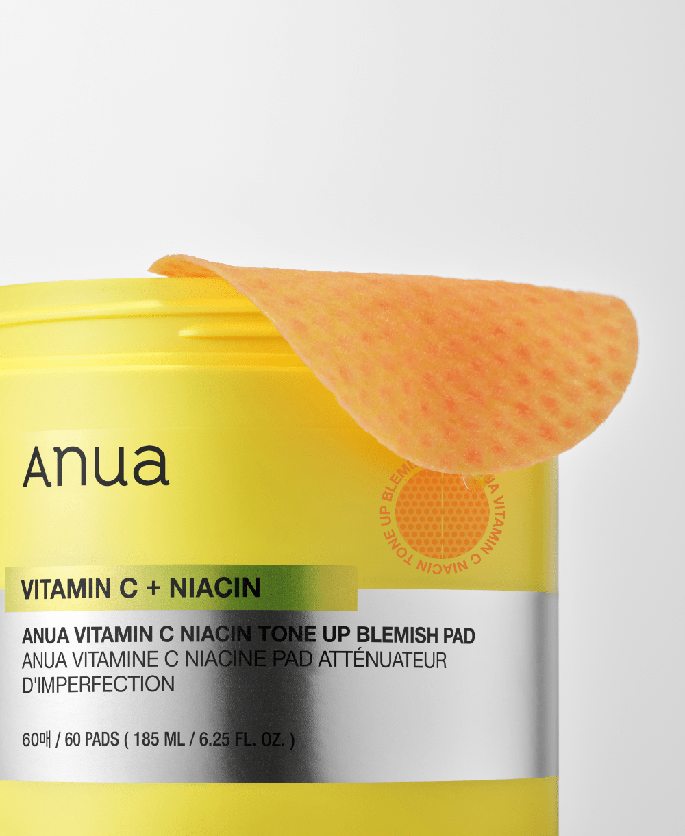 Official close-up of Anua Vitamin C Niacin pad and matching jar