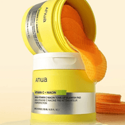 Anua Vitamin C Niacin Tone Up Blemish Pad jars with orange pads