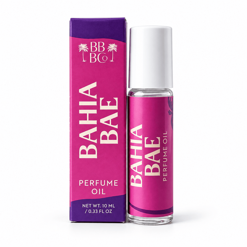 Beachy Bubbles Bath Co Bahia Bae Perfume Oil 10 mL roller with white cap and matching magenta and purple carton on white.