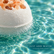 Macro view of the magnesium bath bomb fizzing at the water surface