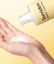 Torriden SOLID IN Cream Toner: milky texture dispensed into the palm